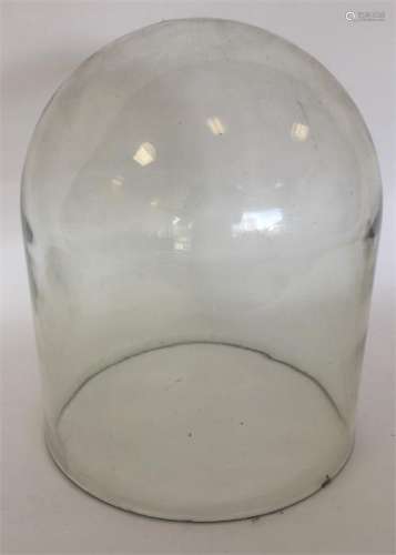 An unusual large glass dome. Approx. 37 cms high.