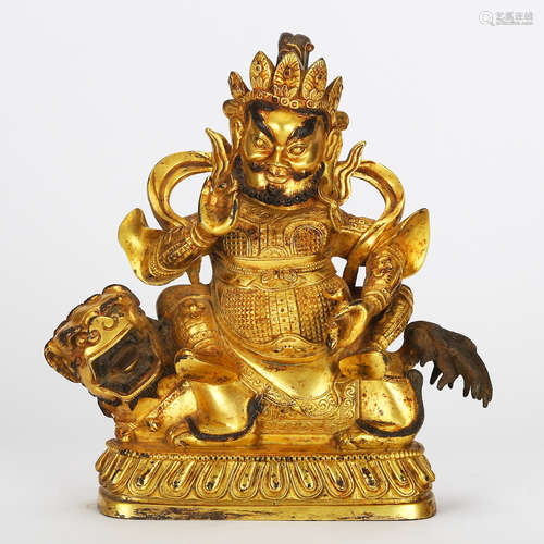 CHINESE GILT BRONZE FIGURE OF JAMBHALA