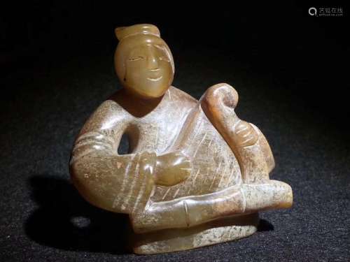 A JADE FIGURE OF A FEMAL MUSICIAN