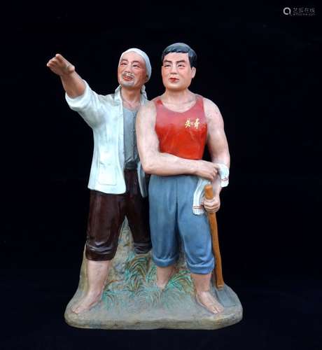 A PORCELAIN STATUE OF TWO MEN