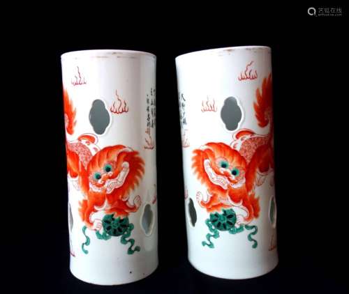 A PAIR OF FAMILLE ROSE 'LION' HAT HOLDERS, TONGZHI