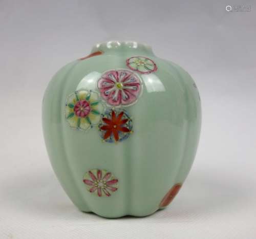 A CELADON GROUND AND FAMILLE ROSE LOBE JAR