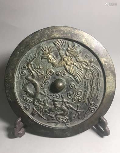 A CIRCULAR BRONZE MIRROR