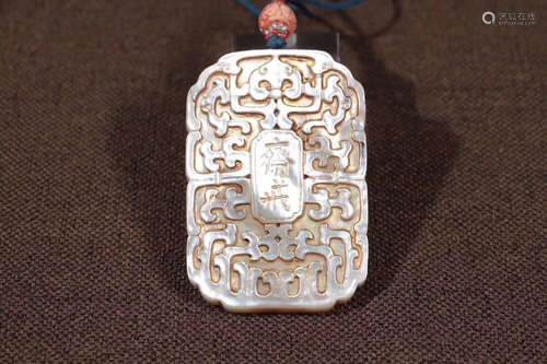 A SHELL CARVED PENDANT