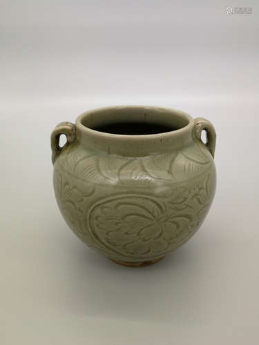 China,Yaozhou kiln produces a small jar with two ears.