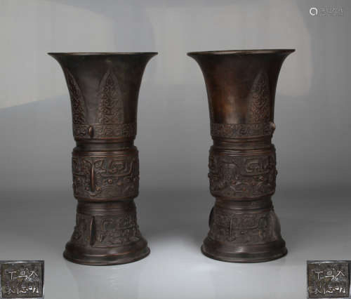 PAIR OF BRONZE MOLDED GU VASES