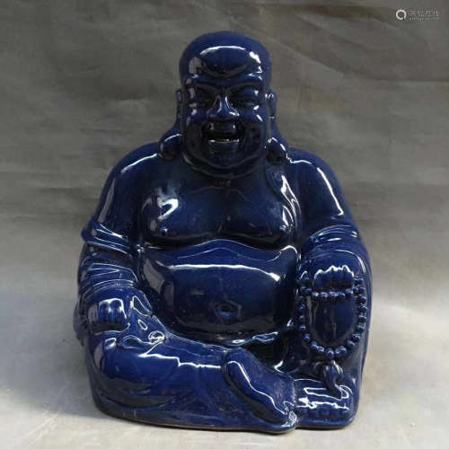 A BLUE GLAZE LAUGHING BUDDHA PORCELAIN STATUE