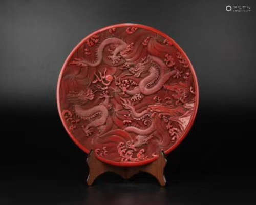 A RED LACQUER DRAGON PATTERN CHARGER