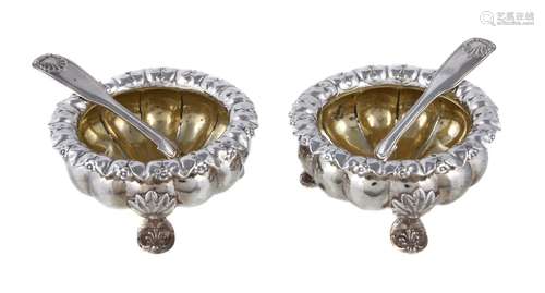 A pair of George III or IV silver cauldron salts, marks worn, with everted foliate rims, the lobed