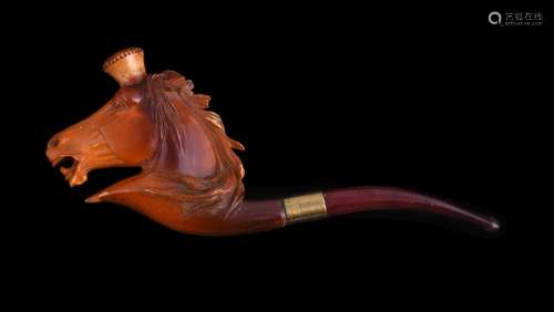 A meerschaum cheroot pipe, early 20th century, carved as a horse's head, with an amber mouthpiece,