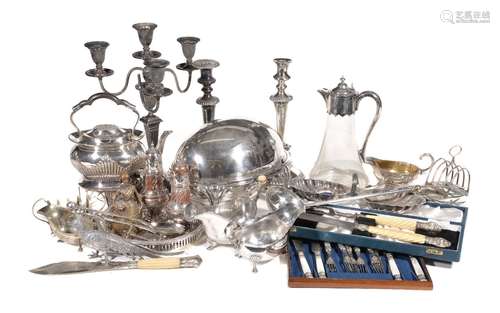 A collection of plated wares, including: a mounted clear glass claret jug; an oval revolving