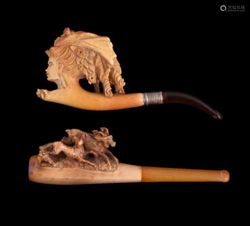 Two meerschaum cheroot pipes, each circa 1900, the first carved as a lady's head, the second with