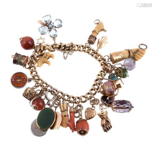 ϒ A charm bracelet, composed of curb links with various gem set and other charms, including: