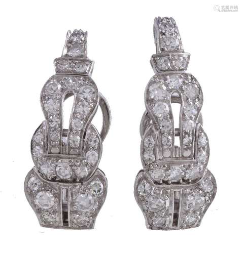 A pair of diamond earrings, the curved panels set with eight cut diamonds, approximately 0.90 carats