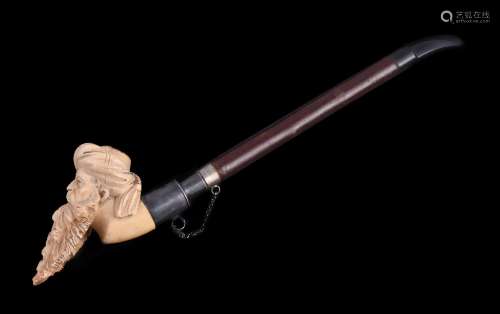 A meerschaum pipe, 20th century, carved as a turbaned Turk's head, with a plated stem holder, a