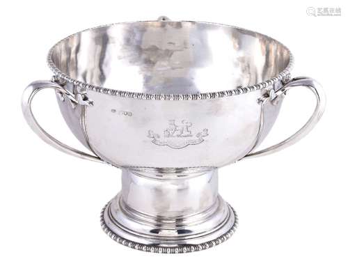 A silver circular pedestal punch bowl by The Goldsmiths and Silversmiths Co. Ltd, London 1913,