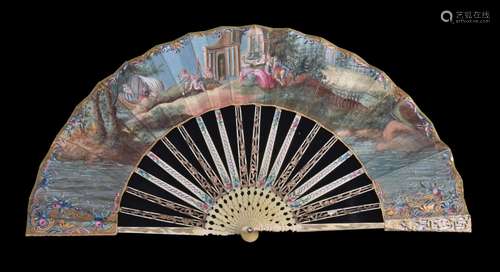 ϒ An ivory fan, late 18th century, the guards pierced and carved with mother of pearl backing, the