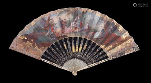 ϒ An ivory fan, late 18th century, the guards pierced and carved with mother of pearl backing,