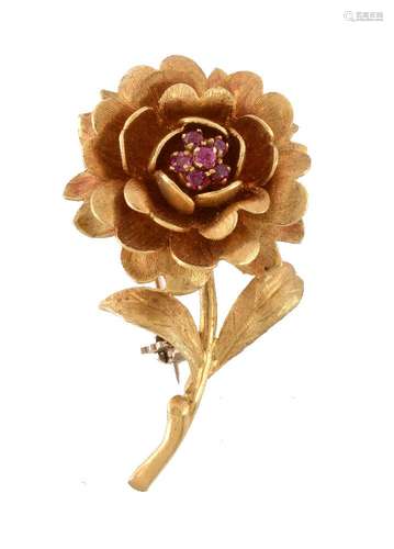 A 1960s 18 carat gold ruby flower head brooch, the flower with a textured finish, set with a cluster