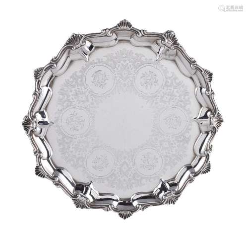 A Victorian silver shaped circular salver by Alexander Macrae, London 1859, with a shell and