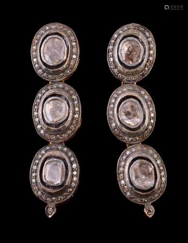 A pair of diamond earrings, the ear pendants set with lasque diamonds each within a surround of