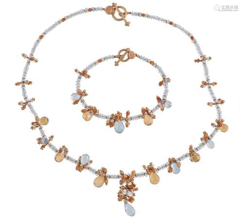 An aquamarine and citrine necklace, composed of facetted aquamarine beads with a fringe of