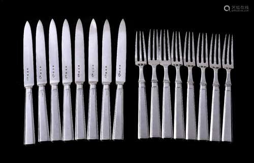 A set of eight Art Deco silver fruit knives and forks by The Goldsmiths & Silversmiths Co. Ltd,