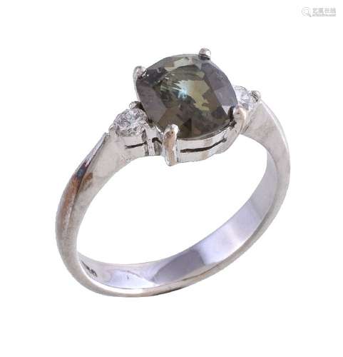 An alexandrite and diamond ring, the oval cut alexandrite claw set between brilliant cut diamonds,