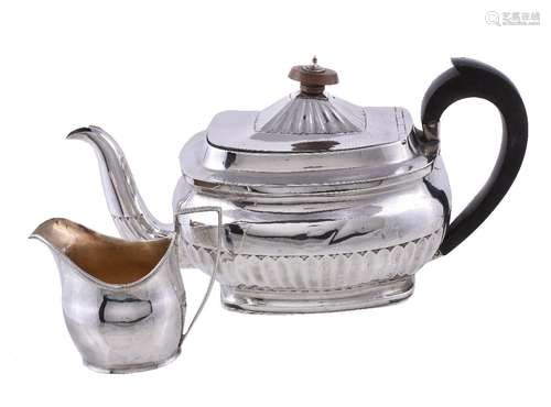 A George III silver oblong baluster tea pot by Alexander Field, London 1806, with an oval wooden