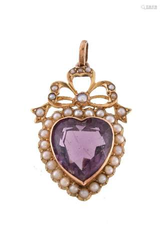 An Edwardian amethyst and seed pearl pendant, the heart shaped amethyst within a surround of seed