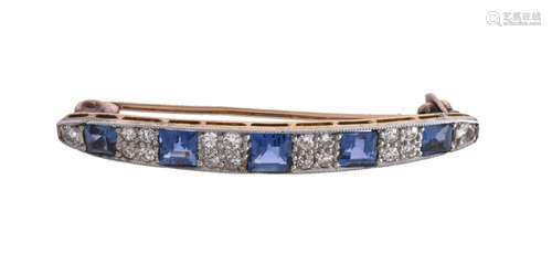 An early 20th century sapphire and diamond brooch, the slightly curved panel set with square cut