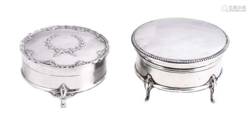 Two silver circular dressing table trinket boxes, the first plain with a beaded rim by Henry