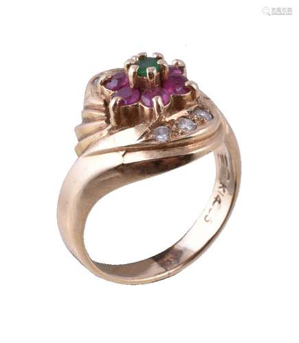 A ruby, diamond and emerald cluster ring, the central circular cut emerald within a surround of