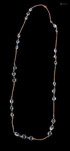 An aquamarine necklace, set with trios of vari cut aquamarines in spectacle link settings, on a