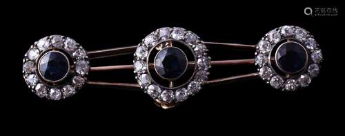 An early 20th century sapphire and diamond brooch, circa 1900, the three clusters each set with a