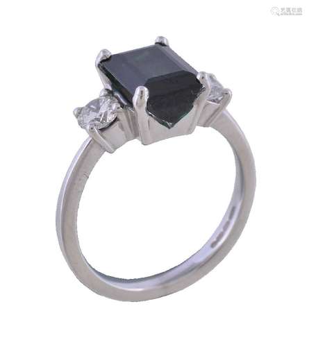 An 18 carat gold green tourmaline and diamond ring, the central rectangular cut green tourmaline