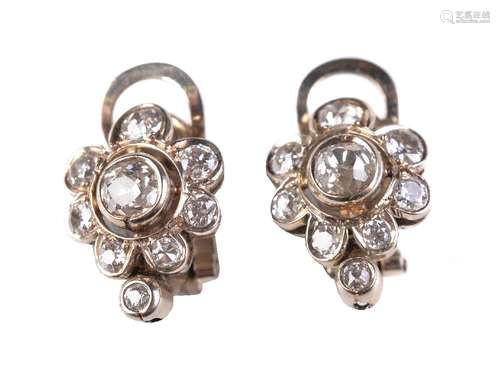 A pair of diamond ear clips, set with a cluster of old cut diamonds, approximately 0.65 carats