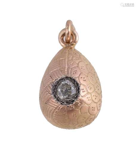 A Soviet diamond set egg pendant, post 1958, the gold coloured egg with two types of engraved