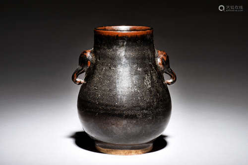 BLACK GLAZED JAR WITH ELEPHANT MASK HANDLES