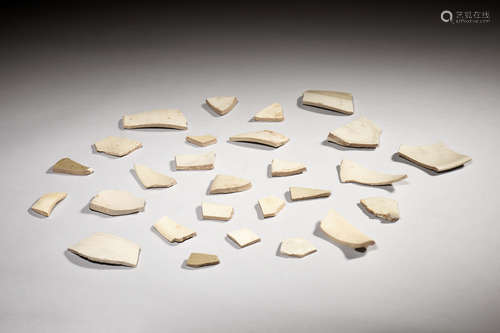 GROUP OF TWENTY-SEVEN DING WARE BROKEN PORCELAIN PIECES