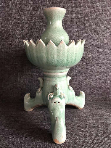 A YUE KILN THREE-FOOT CANDLE HOLDER