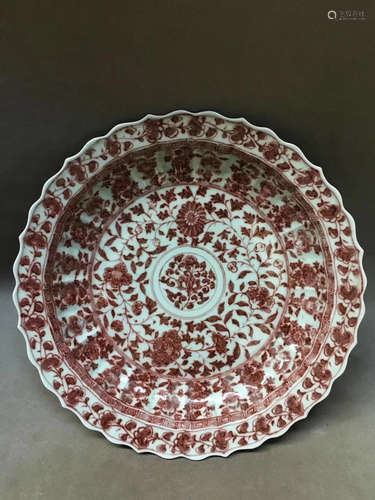 A SUNFLOWER DESIGN RED GLAZED PLATE