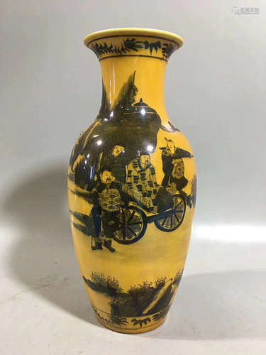 A YELLOW GLAZED STORY DESIGN VASE