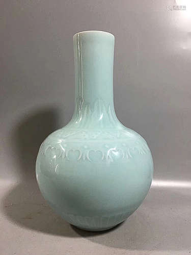 A GREEN GLAZED VASE