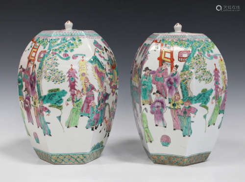 A pair of Chinese famille rose pottery hexagonal jars and covers, modern, decorated with figural