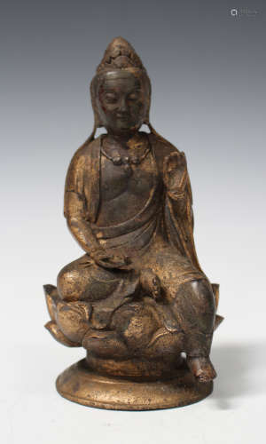 A Chinese bronze figure of Buddha, modelled seated on a lotus moulded throne and circular base,