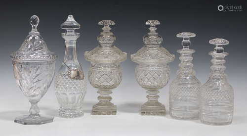 A near pair of Anglo-Irish cut glass sweetmeat jars and covers, 19th century, each with strawberry