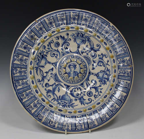 An Italian maiolica blue and white circular charger dish, early 20th century, the centre painted