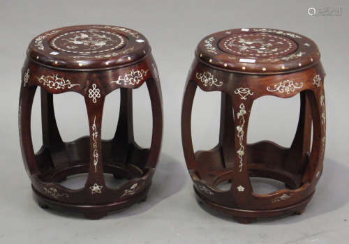 A near pair of Chinese mother-of-pearl inlaid hardwood stands, 20th century, of openwork barrel