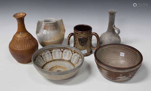 A collection of studio pottery, including a Therese Hawkins bowl, decorated with stylized leaf